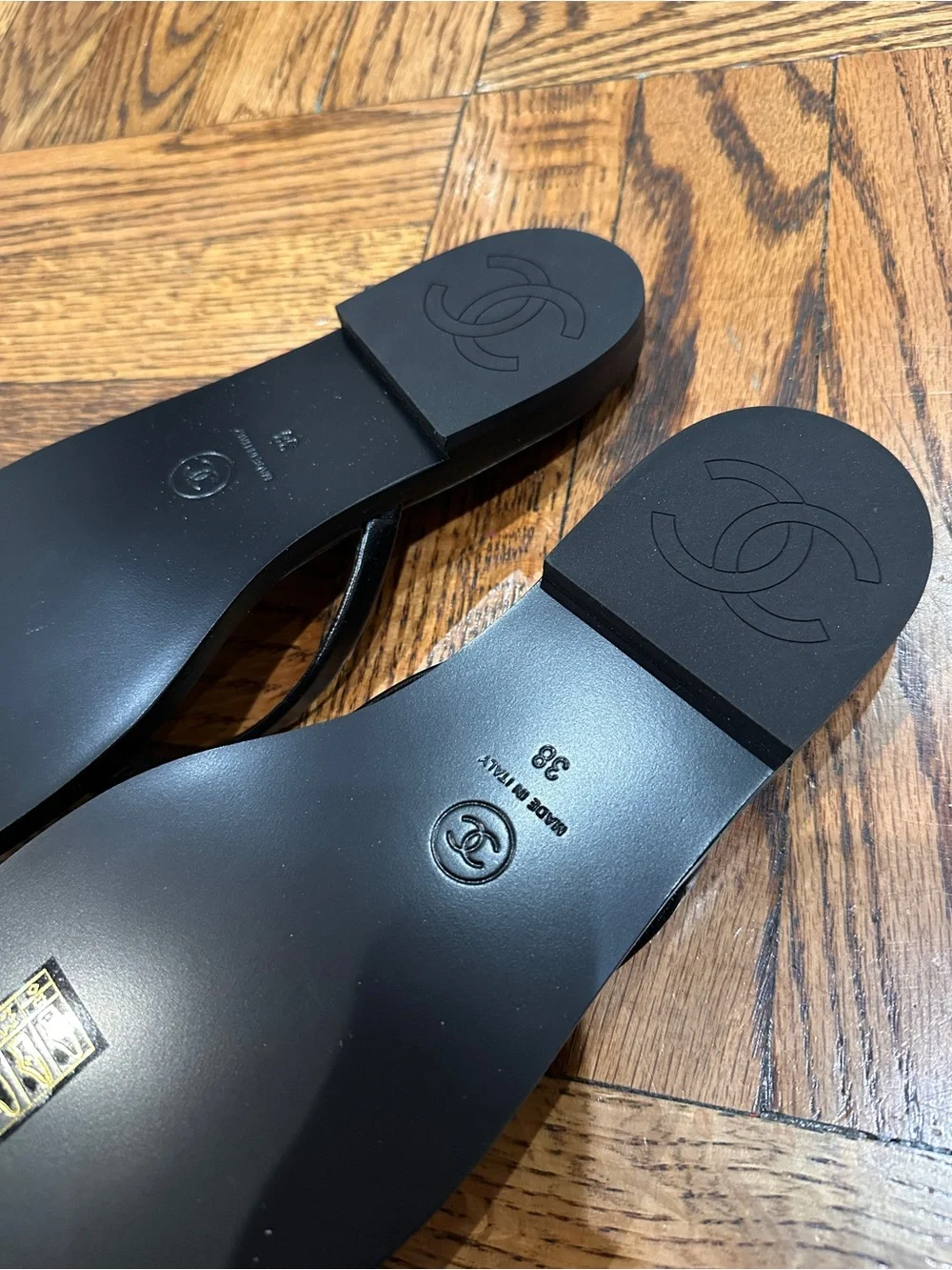 CHANEL Black Leather Logo Thong Sandals with Gold Accent